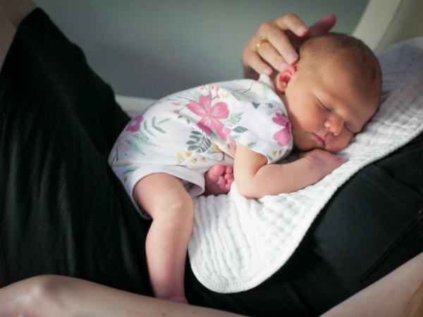 Ai taking over jobs? Sleeping baby on person's chest