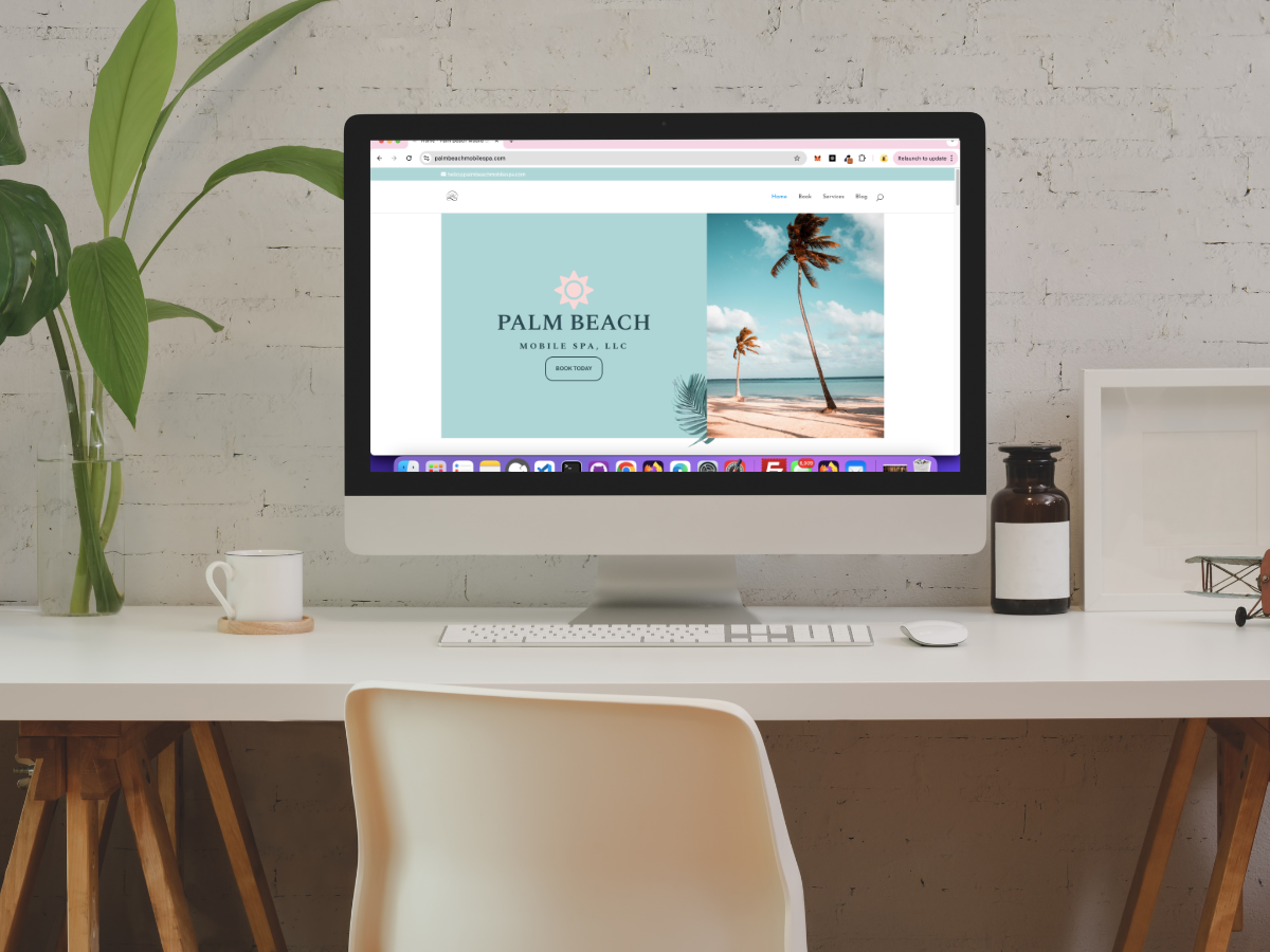 how to make your WordPress website live, image of computer sitting on top of a desk with a plant.